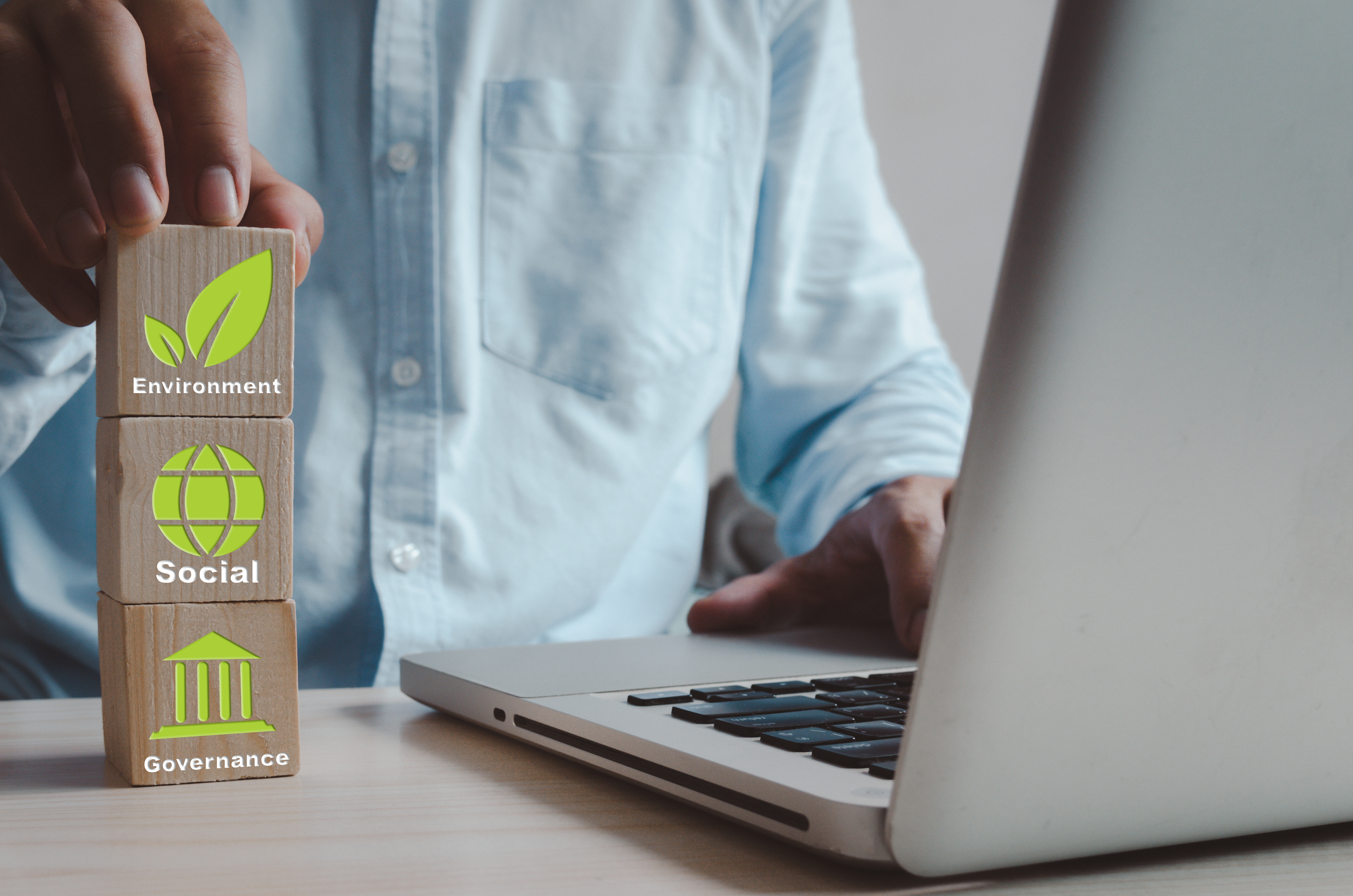 Environmental, social, and governance (ESG) investment Organizat Environmental, social, and governance (ESG) investment Organizational growth. Wooden cube with symbol of esg concept